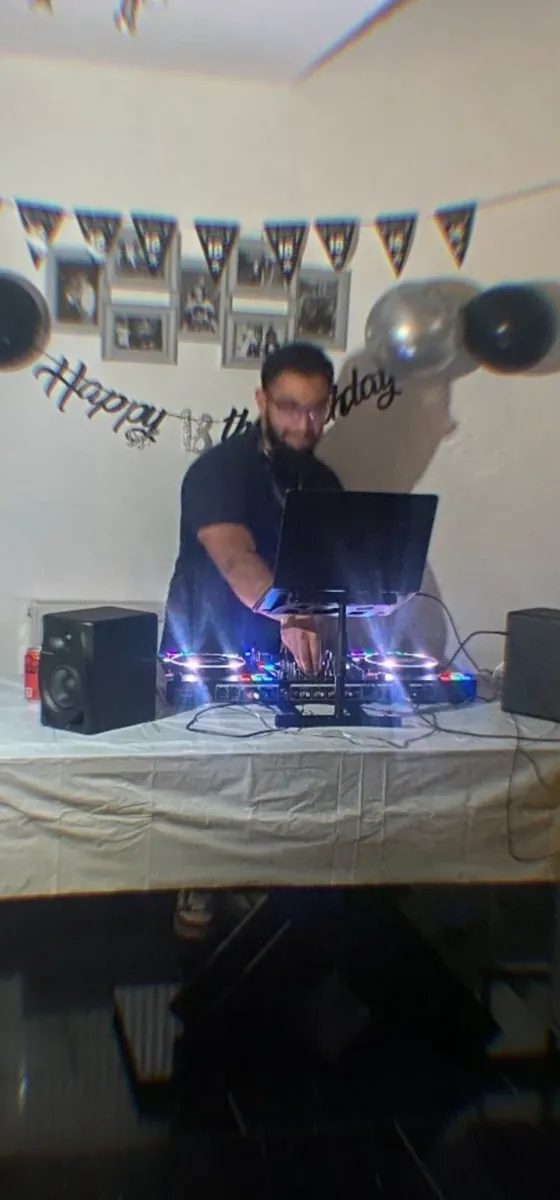 DJ Manraj behind the decks at an 18th birthday party