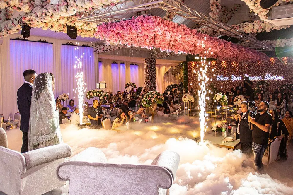 A couple on a cloud-covered floor under blossom ceilings at the Grand Botanical Suite